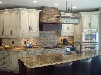 You can pair these cabinets with dull whites, smoky whites, clean whites, warm whites, and cream to create your truly unique classic kitchen. Swita Cabinetry | Distressed cabinets, Off white kitchen ...