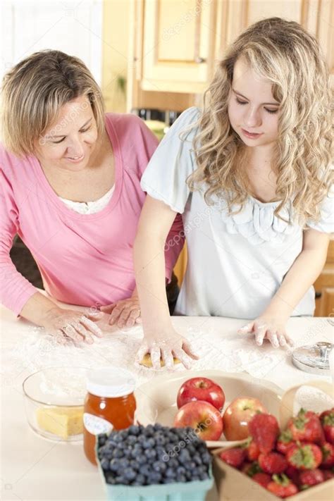 Does anyone know of a guide for daughter for dessert? Baking. Caucasian mother and daughter in the kitchen ...