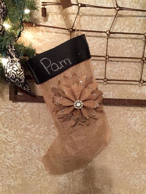 Get ready to bring on the christmas gifting magic. Burlap stocking with chalkboard ribbon. Name written with ...