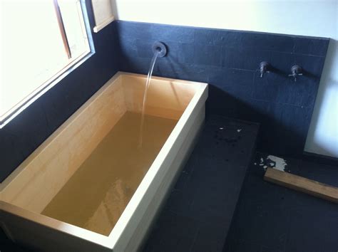 60 x 32 x 23 1/2 surface: tub lowered into place and water tested ok with laminer ...