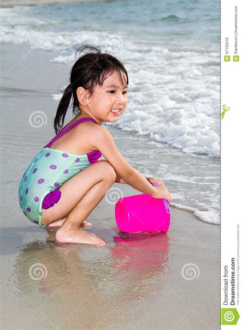 Exotic asian plays with toy. Asian Little Chinese Girl Playing Sand With Beach Toys ...