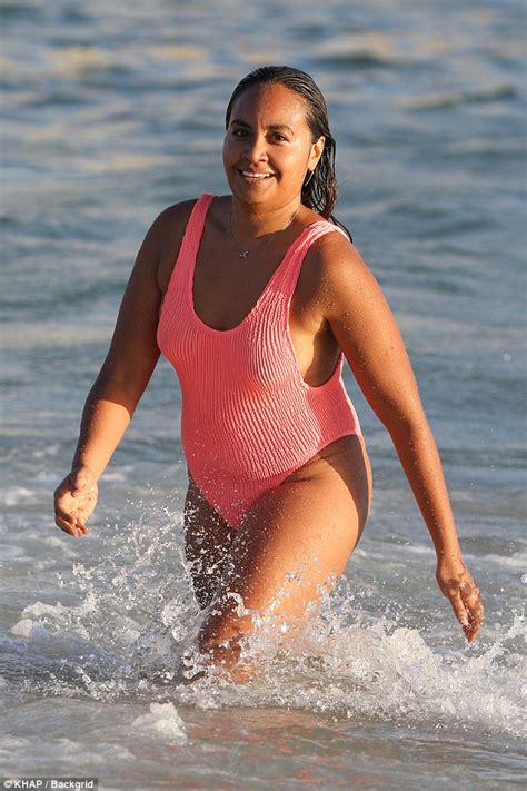 Lesbea trusting best friend for her first time. Jessica Mauboy in one-piece swimsuit at Bondi Beach ...