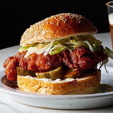 Recipe for a fried nashville hot chicken sandwich with homemade pork rinds. This Nashville-style hot chicken sandwich is guaranteed to ...