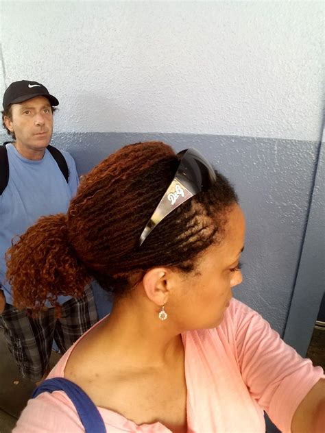 Then tie it up in a pony tail tightly, you don't want it falling out on a ride. Amusement park + Florida heat = Thank God for Sisterlocks ...