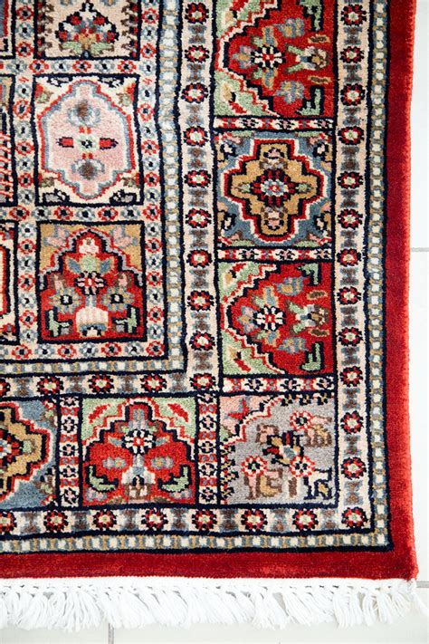 10 chair dining room tables need a 10x14 rug. Hand knotted red coffee table rug with geometric design ...