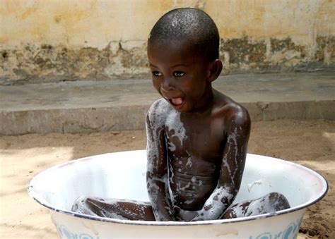 Ideal for a newborn, these infant bathtubs are smaller and fit inside or over a kitchen sink. Africa | Senegal July 2007 - A young boy takes a bath in a ...