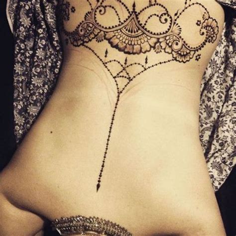 This traditional art was not thought of as tattooing. Best Henna Tattoos for Back: Bold and Beautiful Designs ...