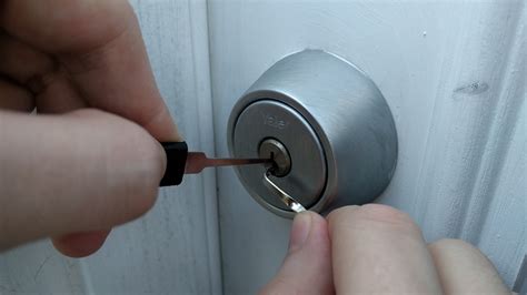 If the doorknob has a small, round hole you'll just need to turn the doorknob as you jiggle the screwdriver about. Learning To Pick Locks Taught Me How Crappy Door Locks Really Are | Lifehacker Australia