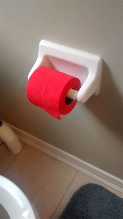 Store your toilet accessories easily. This bathroom has red toilet paper. : mildlyinteresting