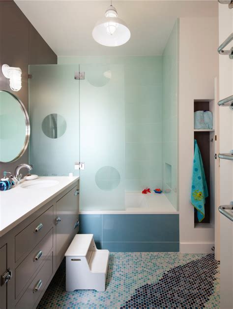 The addition of fancy gold sconces and framed art transform a basic pink powder room into a the coolest space in your house. Colorful Kids Bathroom Ideas | Maison Valentina Blog