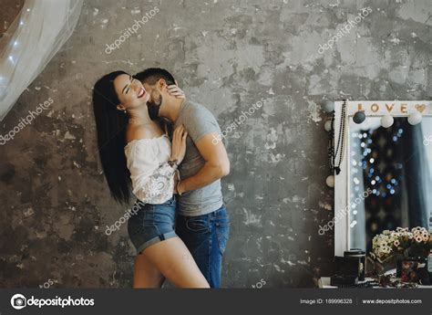 Gograph has the graphic or image that you need for as little as 5 dollars. Passionate couple kissing and laughing on a gray ...