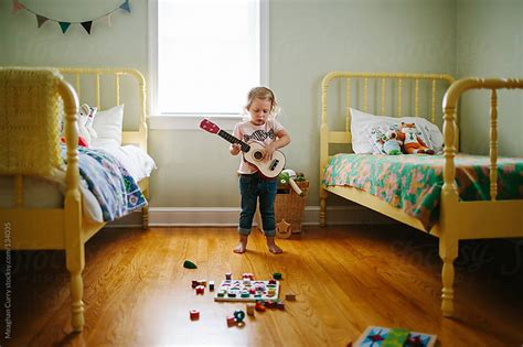 Guitar hanger guitar wall guitar room guitar storage guitar display home music rooms music studio room office music teen boy rooms. little girl playing the guitar in her bedroom by Meaghan ...