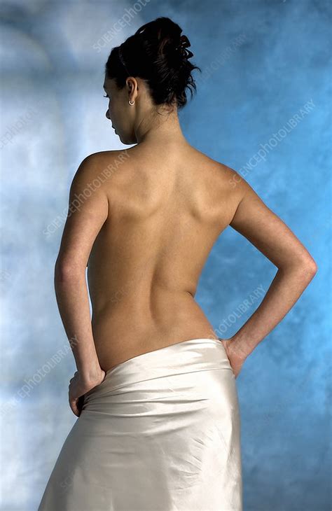 This will help you have an air of confidence that will make you seem appealing to someone who's a little more mature. Woman's back - Stock Image - P700/0382 - Science Photo Library