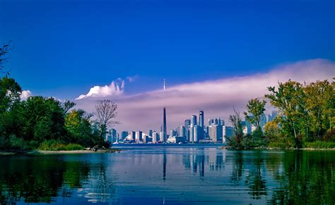 Keeping ontario safe and open. Skyline of Toronto from across the lake in Ontario, Canada ...