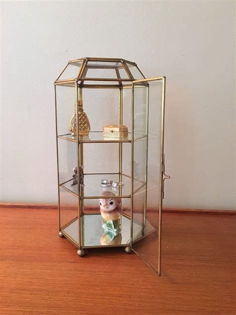 Glass display cabinets are renowned globally for their prestigious aesthetic appeal. Vintage Brass and Glass Curio Cabinet, Figurine Display ...