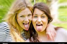 tongue girls sticking two alamy