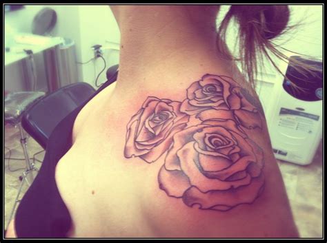 A tattoo designed on the arm. Rose shoulder tattoo just add to more and this is the tat ...