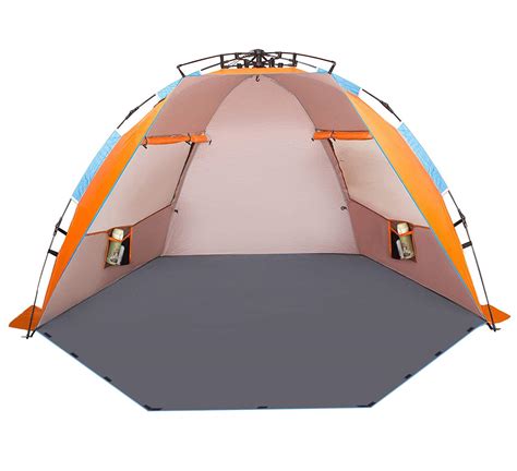 Bring your own shade to the seaside. Oileus X-Large 4 Person Beach Tent Sun Shelter - Portable ...