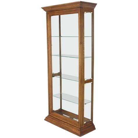 This light oak effect display cabinet has 2 glass doors with attractive silver coloured handles. Tall Narrow Side Doors Beveled Glass Oak Curio Display ...