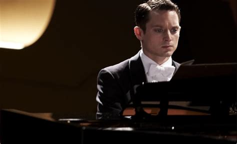 Only he's gotta do it sitting down. Elijah Wood Masters the 'Grand Piano' In First Trailer For ...