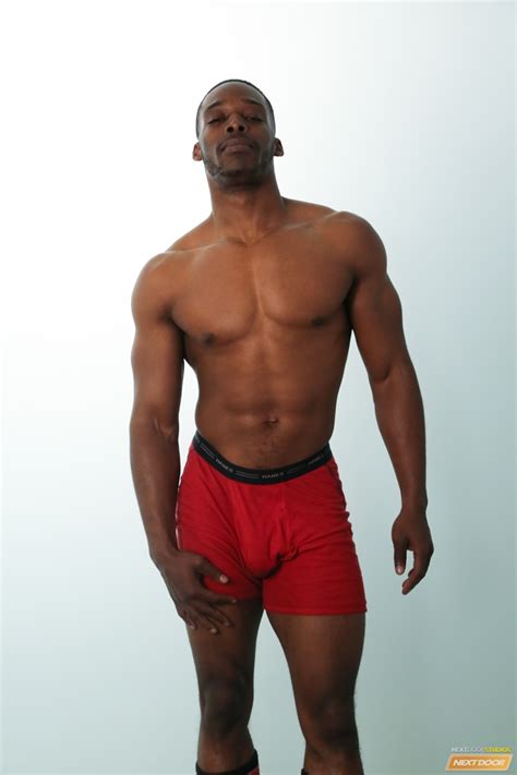 Thick cocked wrestling stud from hotgymnast.com. Big black muscle stud Masson Shores slowly tugs on his ...