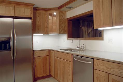 Hardwood floors, white trim and copper coffered ceiling. Refacing or Replacing Kitchen Cabinets