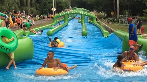 Easy and fully editable.(easy to change colors, text and photos). 'Slide the City' features 1,000-foot water slide in ...