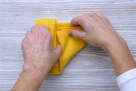 Fold the left edge vertically and tuck the bottom edge into the pocket. How to Fold a Napkin 8 Easy Ways for Your Next Dinner Party