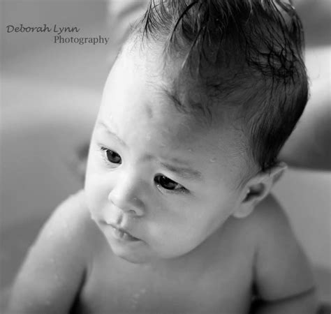 Baby doesn't slip down like in most other baby bath tubs. Who doesn't love a bath in the kitchen sink? | Baby face ...