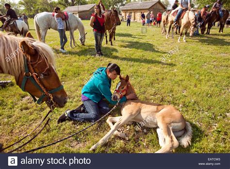 Participants in the 14th annual Crazy Horse Ride gather in ...