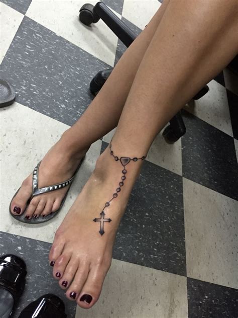 Cross with crown and rosary tattoo. Rosary tattoo on the foot | Foot tattoos, Rosary tattoo, Rosary foot tattoos