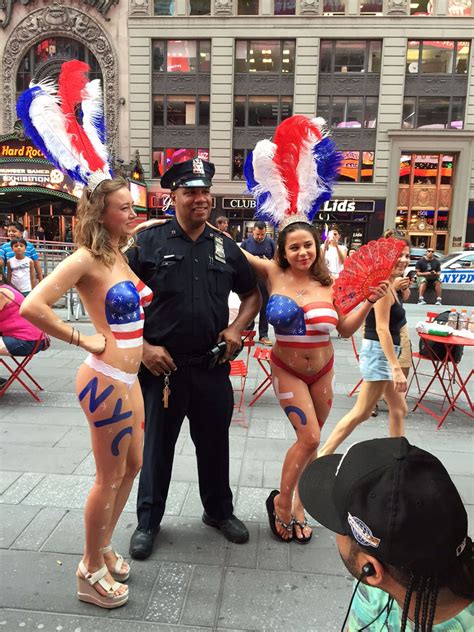 Can't find an ideal job? NYPD cops take photos with topless Times Square women ...