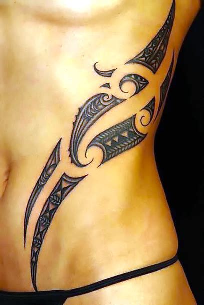 Pretty flowers with tribal patterns. Sexy Tribal Maori Waist Tattoo Idea