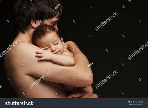 Download a free preview or high quality adobe illustrator ai, eps, pdf and high resolution jpeg versions. Father Holding Newborn Baby Over Black Background Stock ...