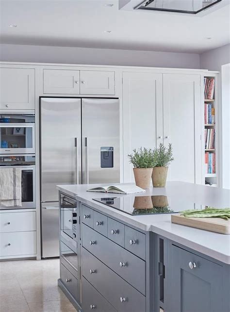 We did not find results for: A ceiling mount vent hood stands over a blue kitchen ...