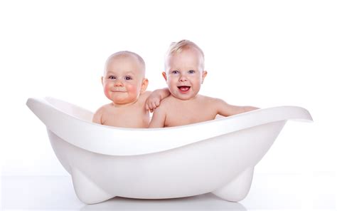 Low angle view of attractive woman holding toddler son while standing near blue baby bathtub. Two Baby Boy Take A Bath High Res Pics wallpaper | cute ...