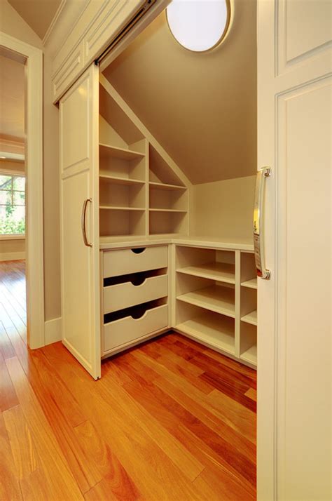 This ceiling over the family room sloped down quickly, but enough space was captured to create a small office and storage area. Sloped Ceiling Closets • Queen Bee of Honey Dos