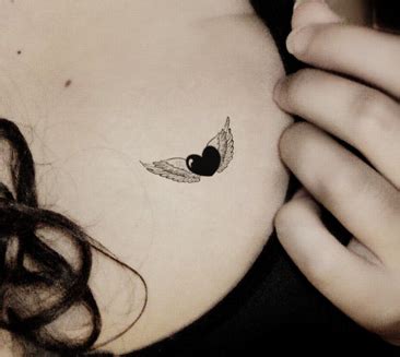 Each wing is a separate piece so you can apply to one nail or two! Small Heart With Angel Wings Tattoo on Chest | Wings ...