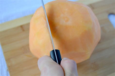 Sniffing and touching a cantaloupe are the best ways to tell if it's ripe or not. How to Cut a Cantaloupe - Clean Eating Veggie Girl