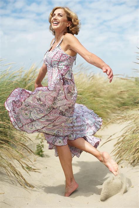 Beautiful, free images gifted by the world's most generous community of photographers. Beautiful Middle Aged Woman Dancing Outdoors Stock Image ...