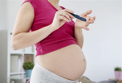 Previously delivering a baby weighing. A pregnant woman checking her blood sugar