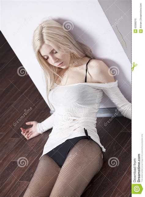 Dreamstime is the world`s largest stock photography community. Dead woman on the floor stock photo. Image of senseless - 62588210