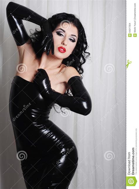 Curly hair all the way. Mistress Wearing Long Black Latex Gloves Stock Photo ...