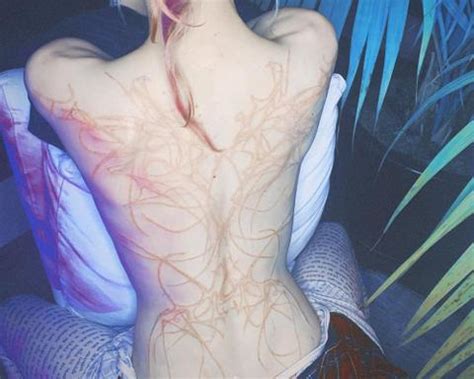 Grimes showed off her unique new ink, which covers nearly her entire back, on instagram sunday. What Is Grimes' Back Tattoo Meaning? It's Pretty ...