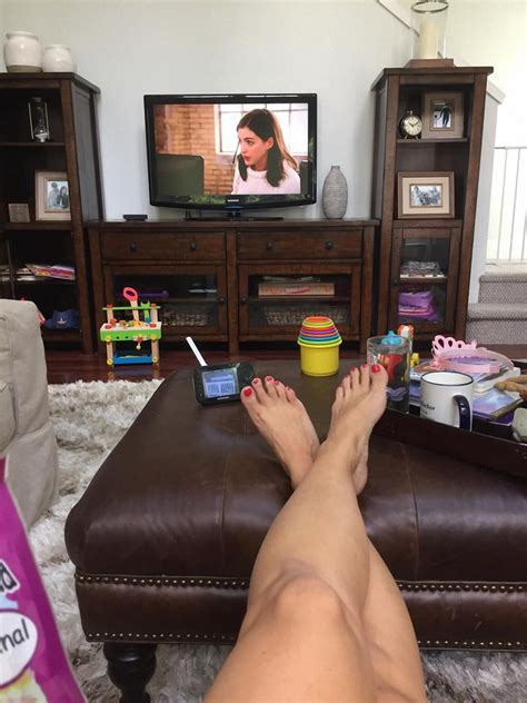 The unaware petite giantess doesn't notice before sliding her feet inside. Amy Stran's Feet