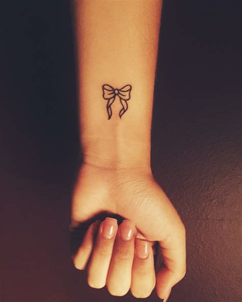 Original tattoo on the back. Small bow tattoo- cute wrist tattoo- | Tattoos | Pinterest ...