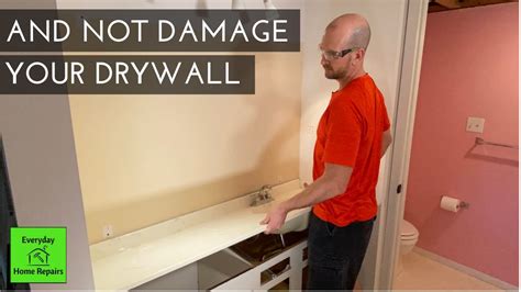 Remove the vanity cabinet check inside the cabinet to determine where it is attached to the wall; How To Remove A Bathroom Vanity and Vanity Top - YouTube