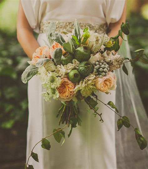 Silk ivory hydrangeas and roses, and real touch ivory calla lilies are accented with soft blush pink peonies, and tied with ivory satin. Whimsical Handmade Treehouse Wedding: Maria + Ben