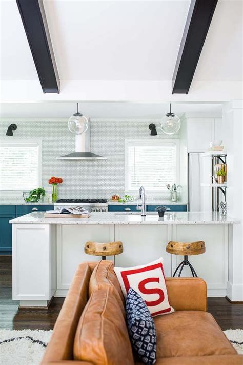 This vibrant teal and white tile is a perfect accent wall, that can easily be coordinated with plain white chevron in the rest of the kitchen. Blue Kitchen Cabinets with White Mini Brick Tile ...