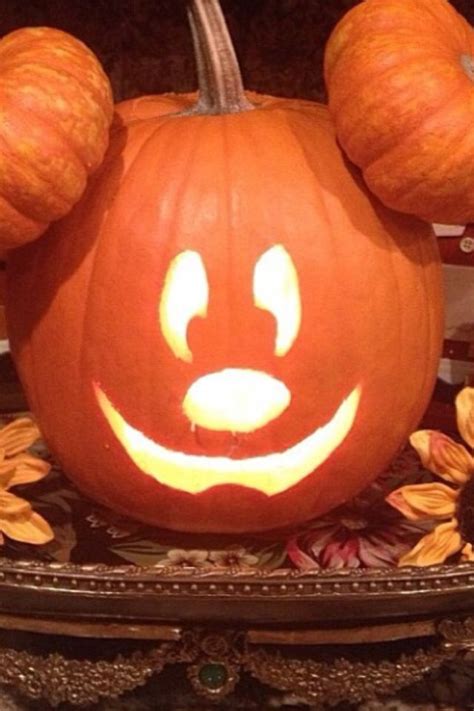 He looks just like a actual pumpkin, but it shaped just like mickey's head with his eyes carved out with them glowing. Pin on holidays